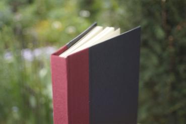 Classic black notebook with burgundy linen spine